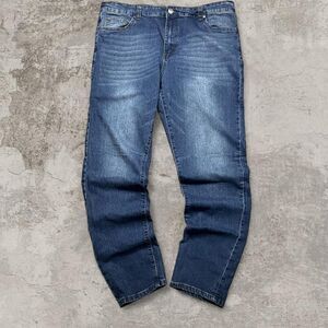 Stitches and rivets blue jeans faded baggy
